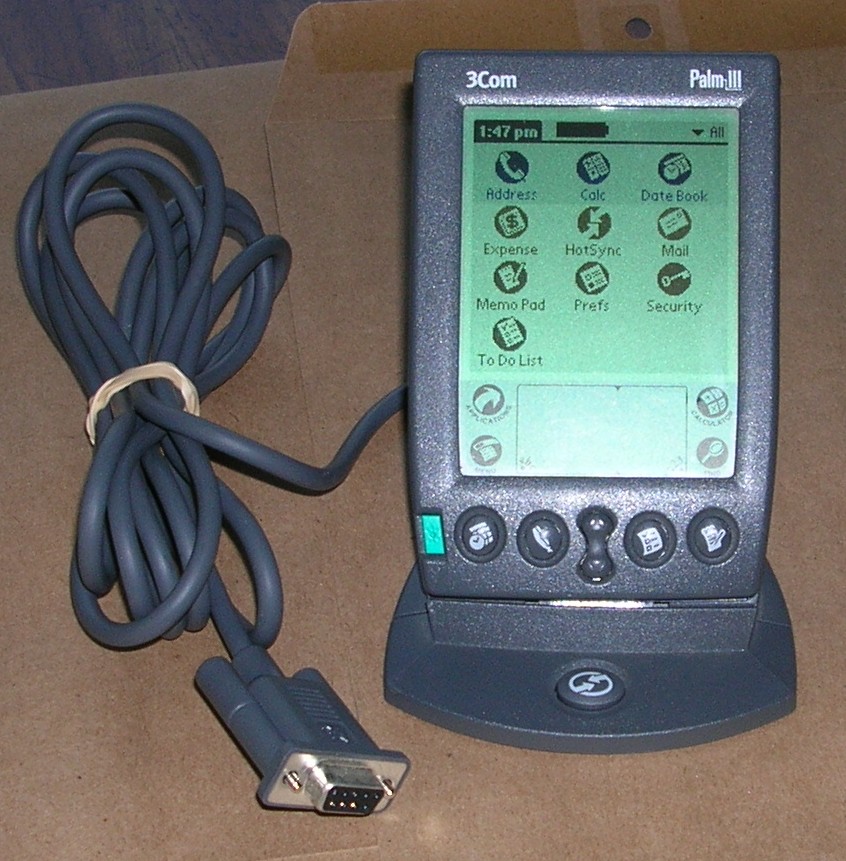 Vintage Palm III on desk with power cable