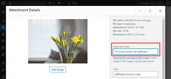 Example of image alt text from WP Beginner showing a vase full of yellow daffodils