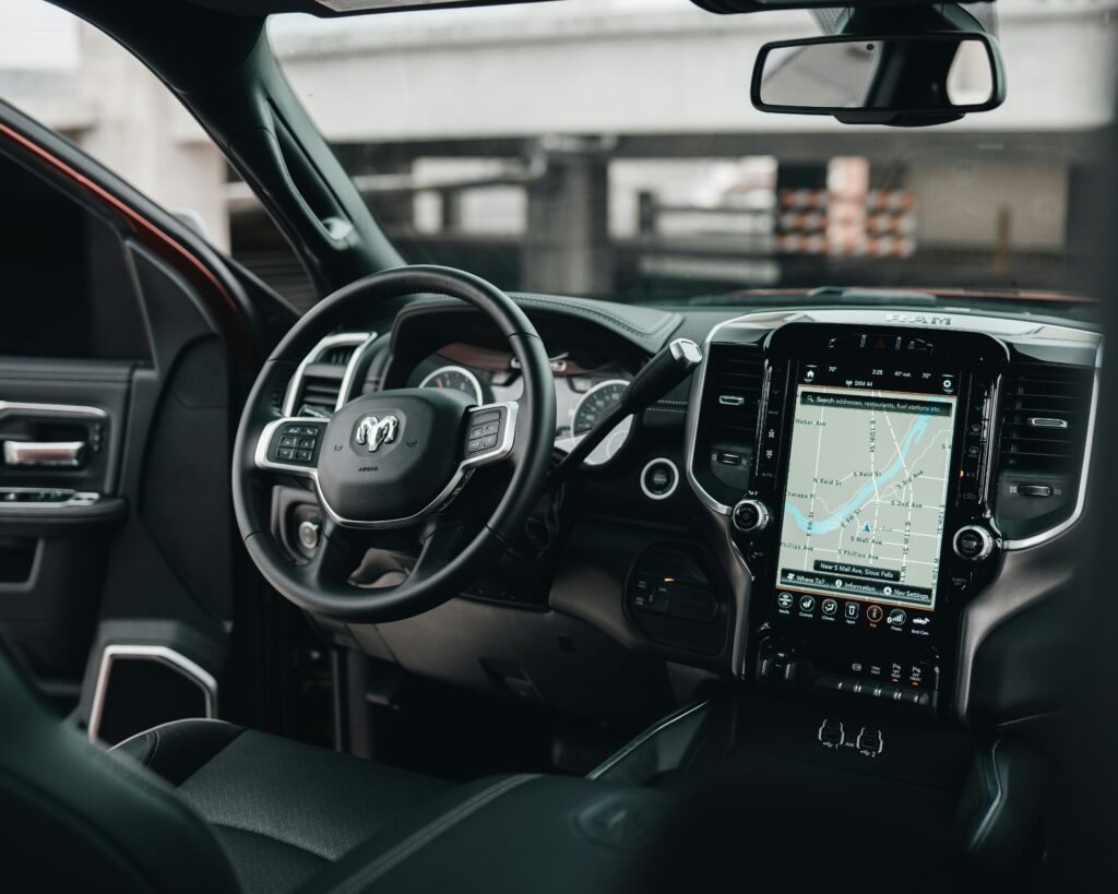 View looking at the wheel and dash of a driverless car