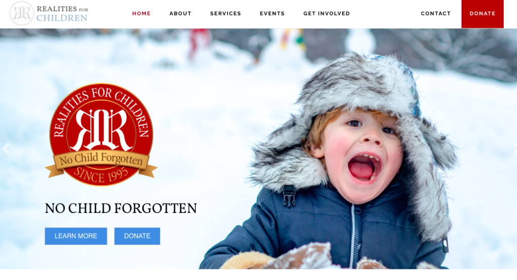 Screenshot of the header image for the Realities For Children website, featuring a boy playing happily in snow