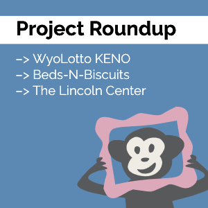 Our monkey mascot Randall looking through a pink picture frame with the words "Project Roundup" at the top