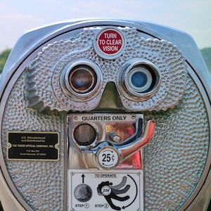 Gray and black coin-operated binoculars